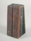 A HEBREW SCRIPT BOOK with wooden ends.