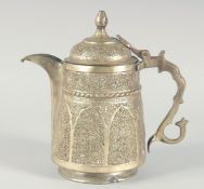 AN ISLAMIC WHITE METAL LIDDED JUG, embossed and chased decoration, 25cm high.