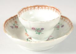 A CHINESE EXPORT ARMORIAL PORCELAIN CUP AND SAUCER DISH, cup 7cm diameter, dish 11.5cm diameter.