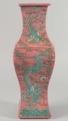 A LARGE CHINESE PINK AND TURQUOISE PORCELAIN VASE, decorated with dragon and phoenix amongst