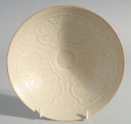 A CHINESE DING WARE CONICAL BOWL, the interior with carved decoration, 20cm diameter.