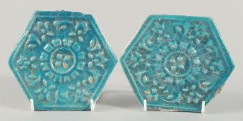 A PAIR OF 13TH CENTURY PERSIAN SELJUK GLAZED POTTERY HEXAGONAL TILES, with raised floral motif