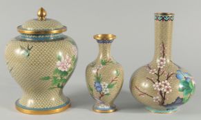 A CHINESE CLOISONNE JAR AND COVER, together with a similar cloisonne bottle vase and a smaller vase,