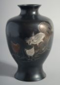 A JAPANESE BRONZE VASE, with mixed metal decoration depicting cockerels, 19cm high.