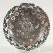 A RARE LARGE EARLY IZNIK STYLE DAMASCUS POTTERY DISH, possibly 16th/17th century