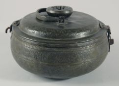 A 16TH/17TH CENTURY OTTOMAN TURKISH TINNED COPPER LIDDED BOWL, with swing handle and hooked latch,