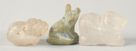 TWO EARLY ISLAMIC CARVED ROCK CRYSTAL ANIMAL FORM BEADS, together with another cat shape bead, (3).