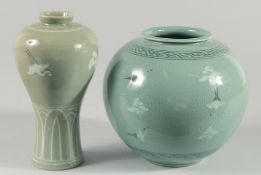 TWO KOREAN PORCELAIN CELADON VASES, decorated with cranes, the larger with character mark to base,