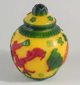 A CHINESE MULTICOLOURED GLASS JAR AND COVER, with raised decoration depicting monkeys on branches,
