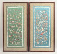TWO 20TH CENTURY CHINESE EMBROIDERED SILK PANELS, depicting hundred boys, framed and glazed, 67cm