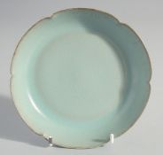 A CHINESE CELADON PETAL FORM DISH, together with collection box, dish inscribed to the base, 14cm