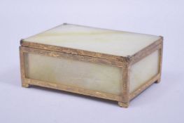 A CHINESE GILT METAL AND JADE LIDDED BOX, 13cm x 9cm.