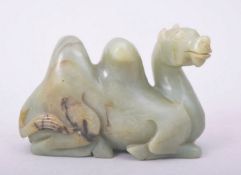 A CARVED JADE MODEL OF A CAMEL, 9cm long.