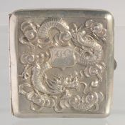 A 19TH CENTURY CHINESE REPOUSSE SILVER CIGARETTE CASE, with embossed dragon, makers mark to spring