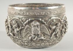A LARGE BURMESE SILVER BOWL, with relief decoration depicting various figures, an elephant and