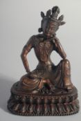 A BRONZE FIGURE OF A SEATED DEITY, 19.5cm high.