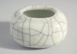A SMALL CHINESE CRACKLE GLAZE INK POT, 6cm wide.