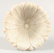 A 19TH CENTURY MUGHAL INDIAN CARVED MARBLE LOTUS FLOWER FORM BOWL, 23cm diameter.