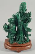 A GOOD CHINESE MALACHITE CARVING of a sage and child, on a fitted wooden stand, 14cm high.