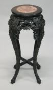 A 19TH CENTURY CHINESE HARDWOOD CIRCULAR STAND with marble inset top, pierced and carved frieze on