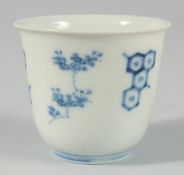 A JAPANESE BLUE AND WHITE PORCELAIN CUP, with four-character mark to base, 7.5cm diameter.