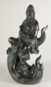 A LARGE CHINESE BRONZE FIGURE OF GUANYIN sitting atop a wave, holding a sceptre, bearing a six-