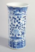 A SMALL CHINESE BLUE AND WHITE PORCELAIN BRUSH POT, (chip to rim), 15cm high.