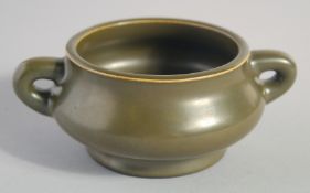 A SMALL CHINESE TEA DUST GLAZE TWIN HANDLE CENSER, with character mark to base, 13cm (handle to