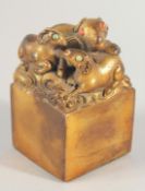 A CHINESE HEAVY BRONZE SEAL, the top formed as rams, four characters to the seal.