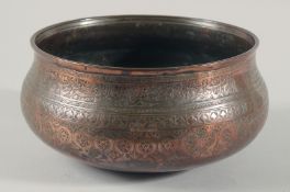 A FINE LARGE 17TH CENTURY PERSIAN SAFAVID COPPER BOWL, engraved with a band of calligraphy and