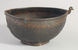 AN ISLAMIC ENGRAVED BRASS KASHKOOL, 20.5cm wide.