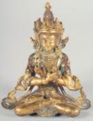 A SMALL GILDED BRONZE FIGURE OF A SEATED DEITY, 13cm high.