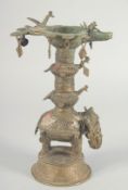 A BURMESE ELEPHANT FORM OIL LAMP, 26.5cm high.