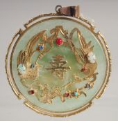 A CHINESE JADE AND YELLOW METAL GEM-SET CIRCULAR PENDANT, 6cm diameter.