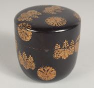 A JAPANESE LACQUER NATSUME / TEA CADDY, in Kodaiji style decorated with gold chrysanthemum crests,