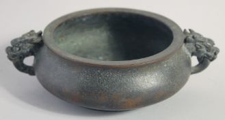 A CHINESE BRONZE TWIN HANDLE CENSER, the handles formed as dragon heads, character mark to base,