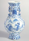 A CHINESE BLUE AND WHITE PORCELAIN VASE, with moulded handles and painted with figures, mark to