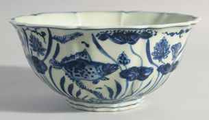 A CHINESE BLUE AND WHITE PORCELAIN PETAL FORM BOWL, decorated with fish and algae, 22.5cm diameter.