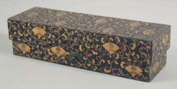 A JAPANESE GILT AND BLACK LACQUERED RECTANGULAR BOX, decorated with fan motifs and scrolling vine,
