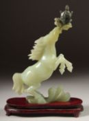 A FINE CHINESE JADE CARVING OF A HORSE and turtle, on a fitted wooden base, together with original