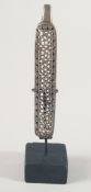 A SAFAVID PIERCED AND ENGRAVED METAL BELT HOOK / CLASP, with display stand, clasp 10cm long.