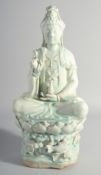A LARGE CHINESE YINGQING GLAZE QUANYIN seated upon a lotus throne, 45cm high.