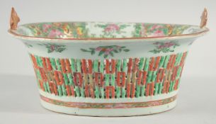 A CHINESE CANTON FAMILLE ROSE PIERCED PORCELAIN BASKET DISH, (af), 25cm x 22cm.