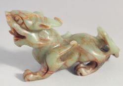 A CHINESE CARVED SOAPSTONE FIGURE OF A DRAGON, 15cm long.