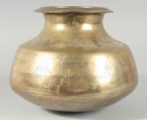 AN ISLAMIC HEAVY BRONZE VASE, with engraved decoration of fish motifs, inscribed, 23cm high.