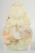 A CHINESE CARVED AND PIERCED JADE BI DISK. 34cm long