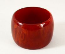 A GOOD ISLAMIC BAKELITE BANGLE - 6cm opening.