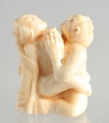 A CARVED BONE EROTIC NETSUKE. 1.5ins.