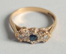 A 9CT GOLD SAPPHIRE AND DIAMOND RING.