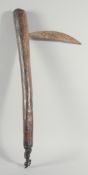 AN EARLY TRIBAL AXE.